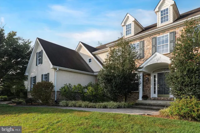 a view of house with outdoor space and swimming pool