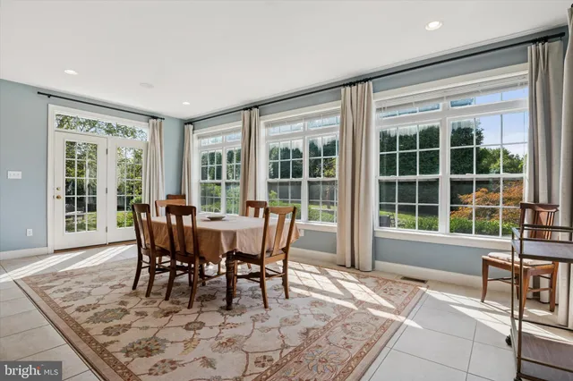 a bedroom with a bed couch and a window
