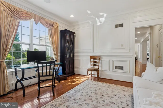 a bathroom with a toilet a sink and a mirror