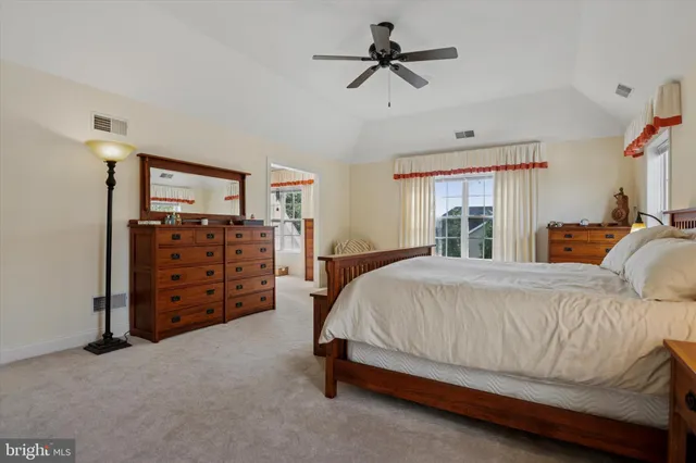 a bathroom with a double vanity sink mirror and toilet