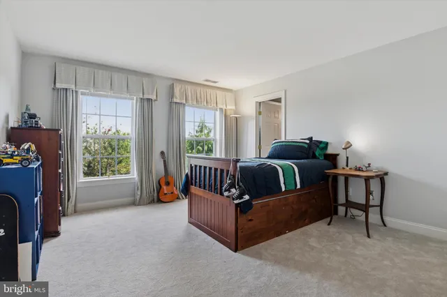 a dining room with furniture and a kitchen