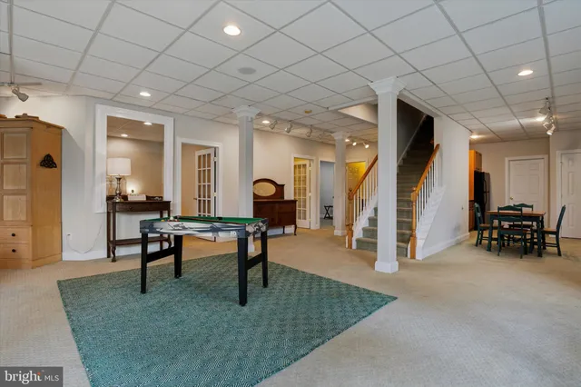 a view of a house with a yard and garage