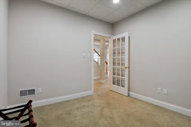 a big house with a big yard and large trees