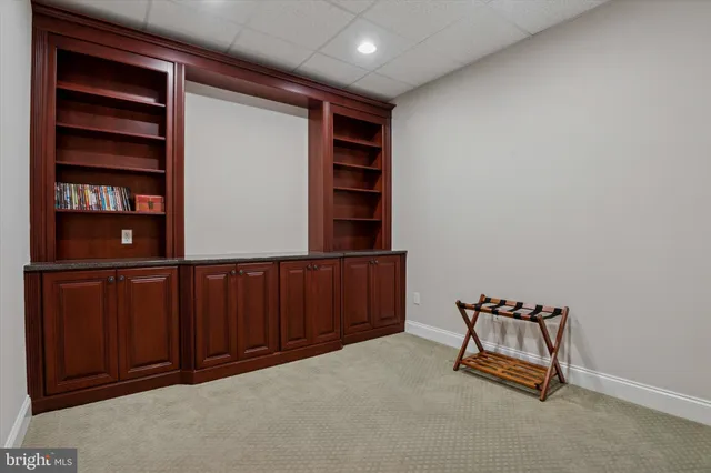 an aerial view of a house with yard swimming pool and outdoor seating