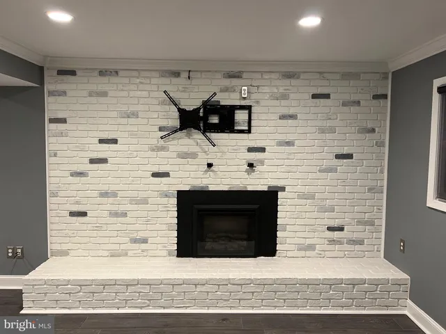 a hall with a sink and a vanity