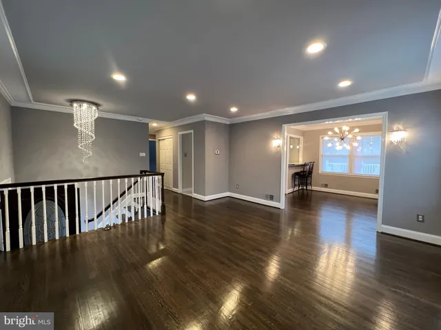 a view of a room with wooden floor