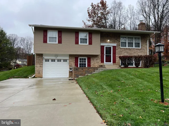 a sign that is on the wall with a white wall