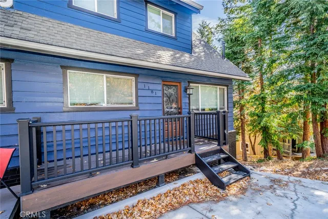 a view of backyard with deck and wooden floor