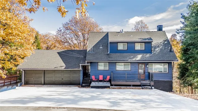 a view of a house with a tree