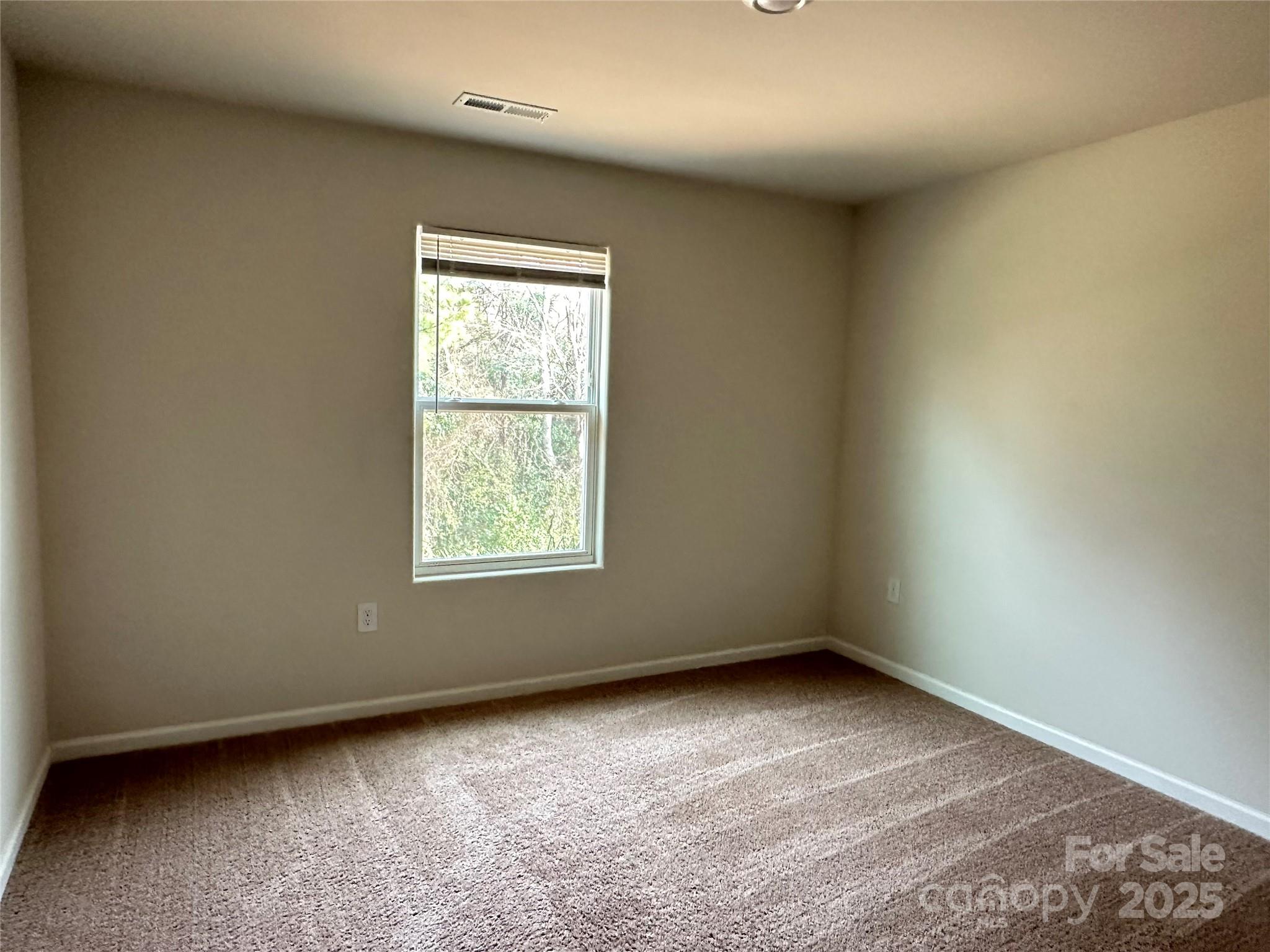 1345 Nia Road Charlotte, NC 28215 - Photo 14 of 19 an empty room with a window