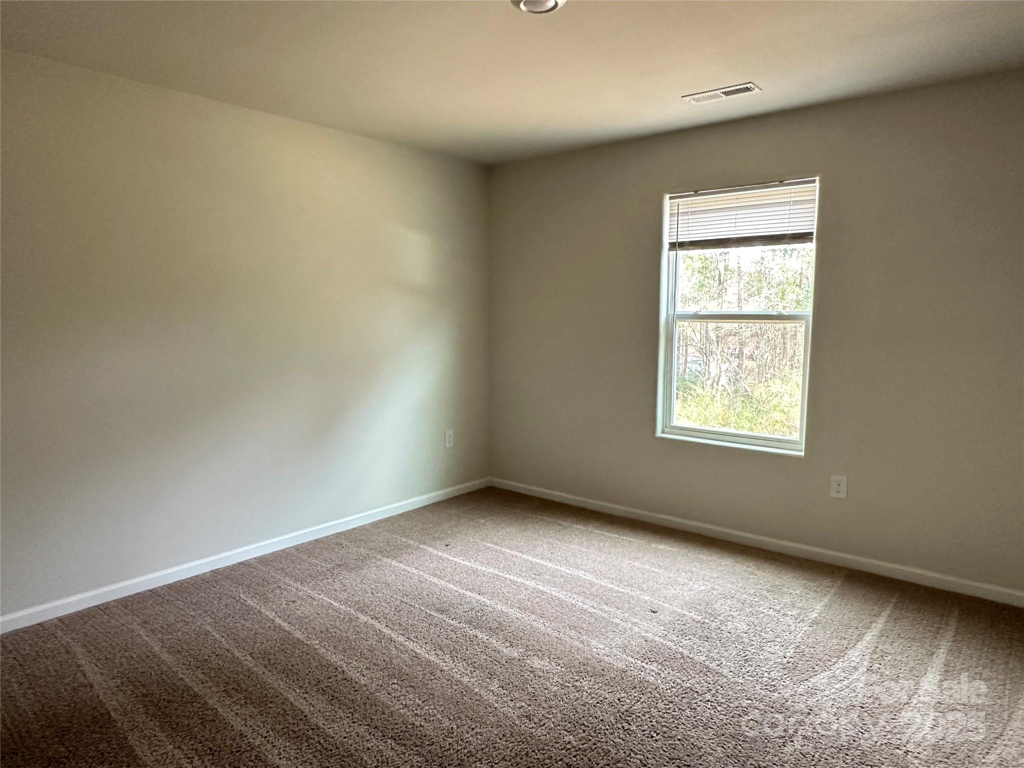 1345 Nia Road Charlotte, NC 28215 - Photo 16 of 19 an empty room with a window