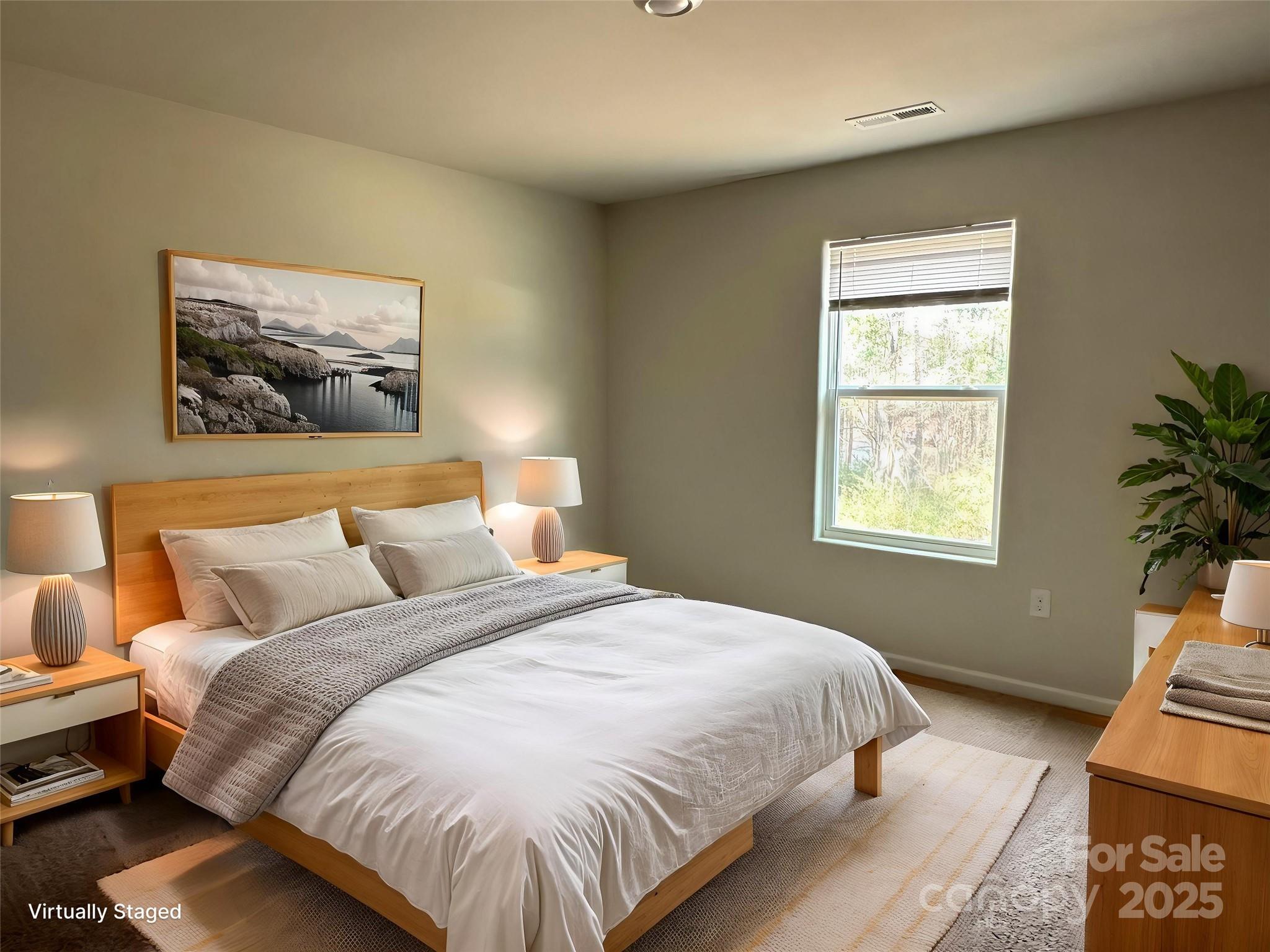 1345 Nia Road Charlotte, NC 28215 - Photo 17 of 19 a large bed sitting in a bedroom next to a window