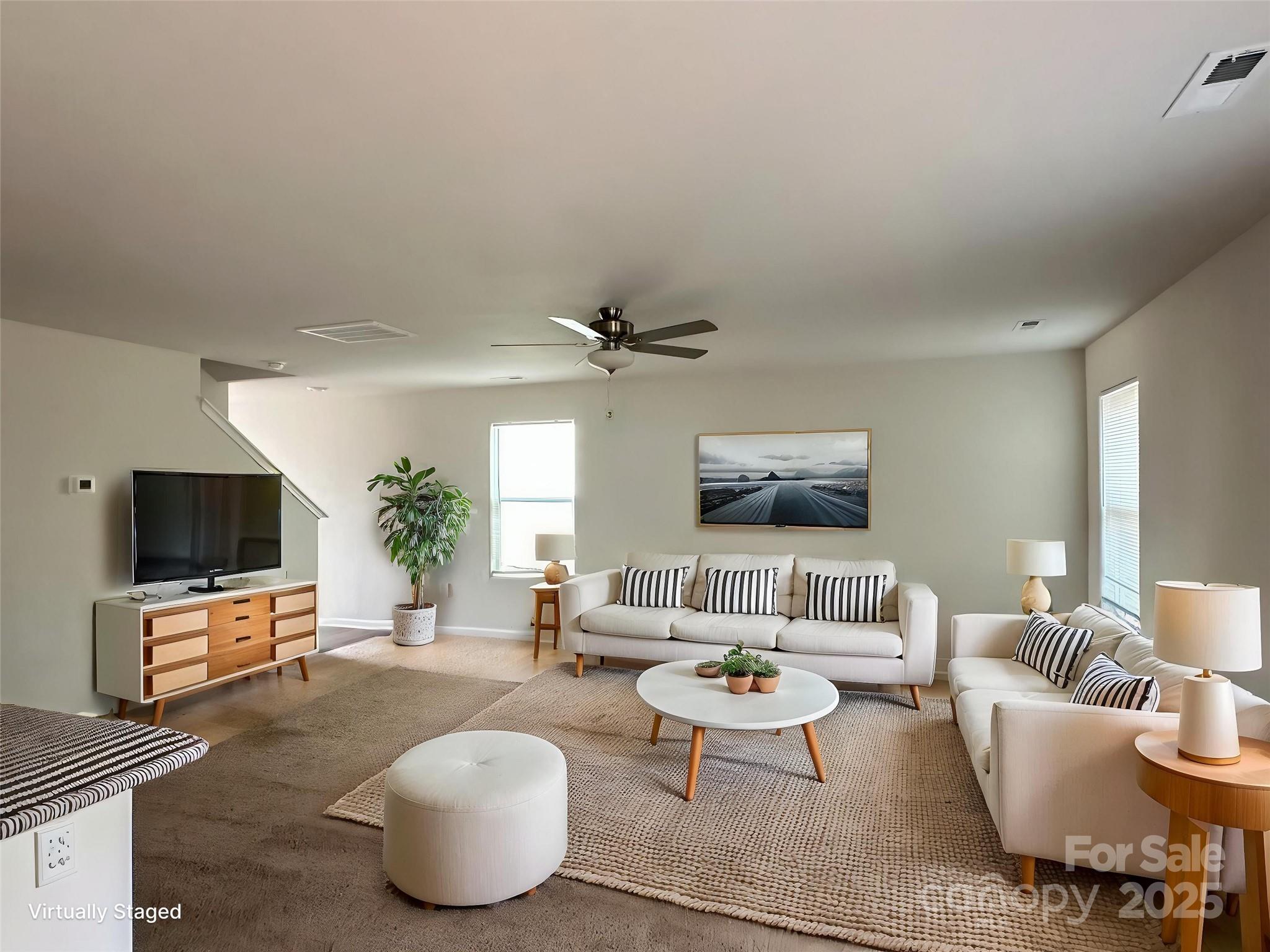 1345 Nia Road Charlotte, NC 28215 - Photo 4 of 19 a living room with furniture and a flat screen tv