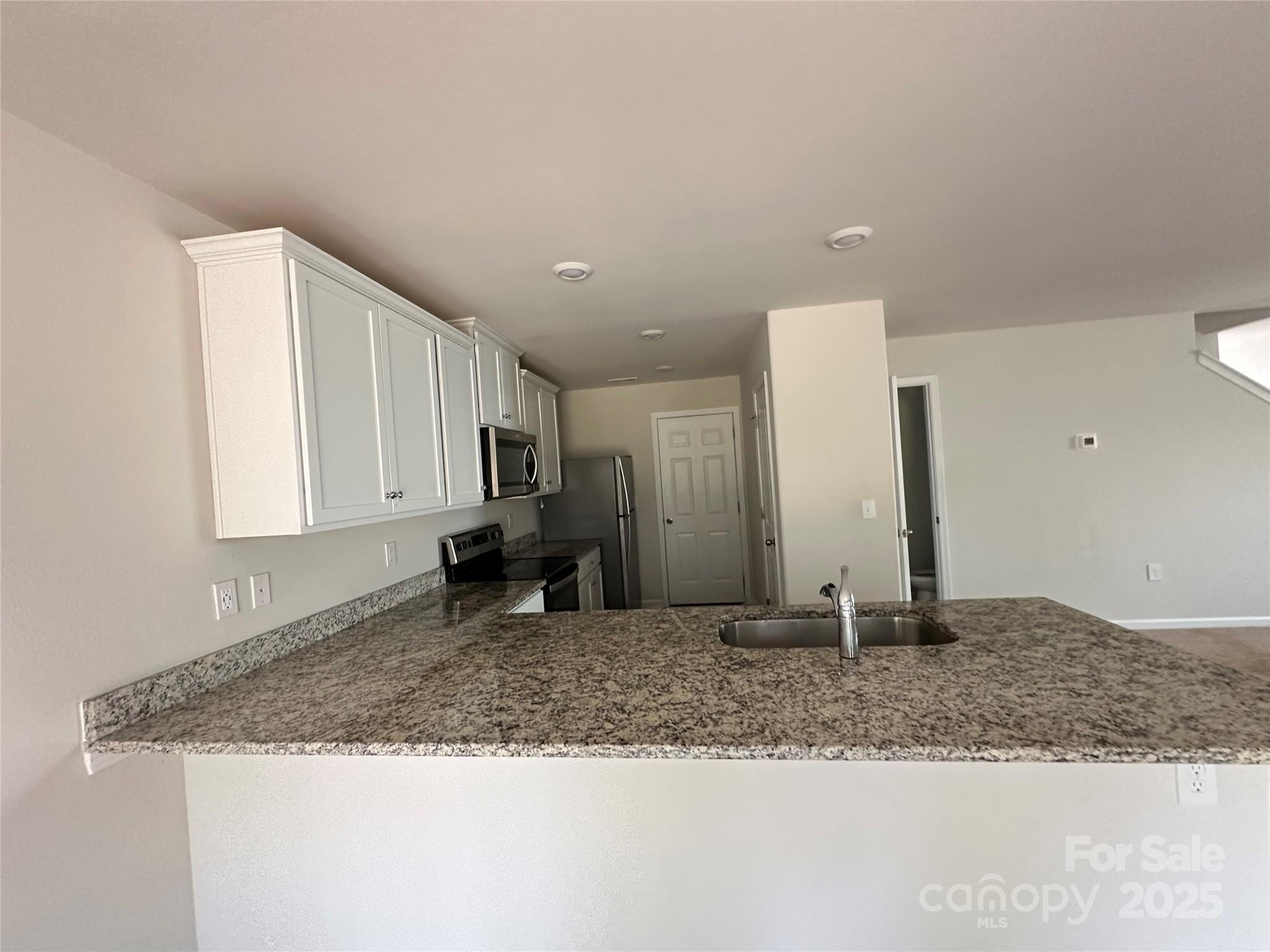 1345 Nia Road Charlotte, NC 28215 - Photo 7 of 19 a view of a kitchen counter top space and a sink