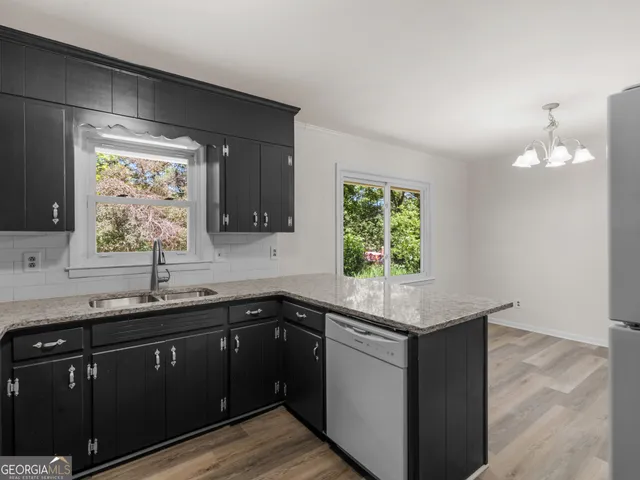 a kitchen with a sink and a window