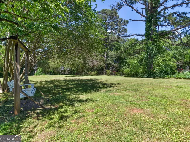 a view of a field with trees