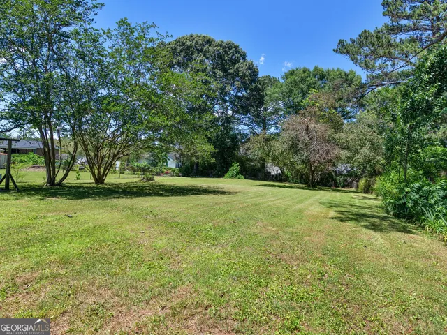 a view of a field with trees