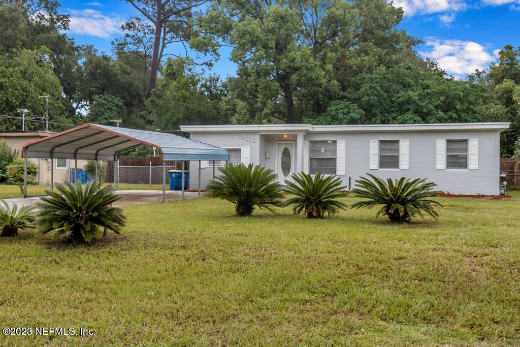 10625 Rutgers Road Jacksonville, FL 32218 - Photo 2 of 37 a view of a house with pool and a table