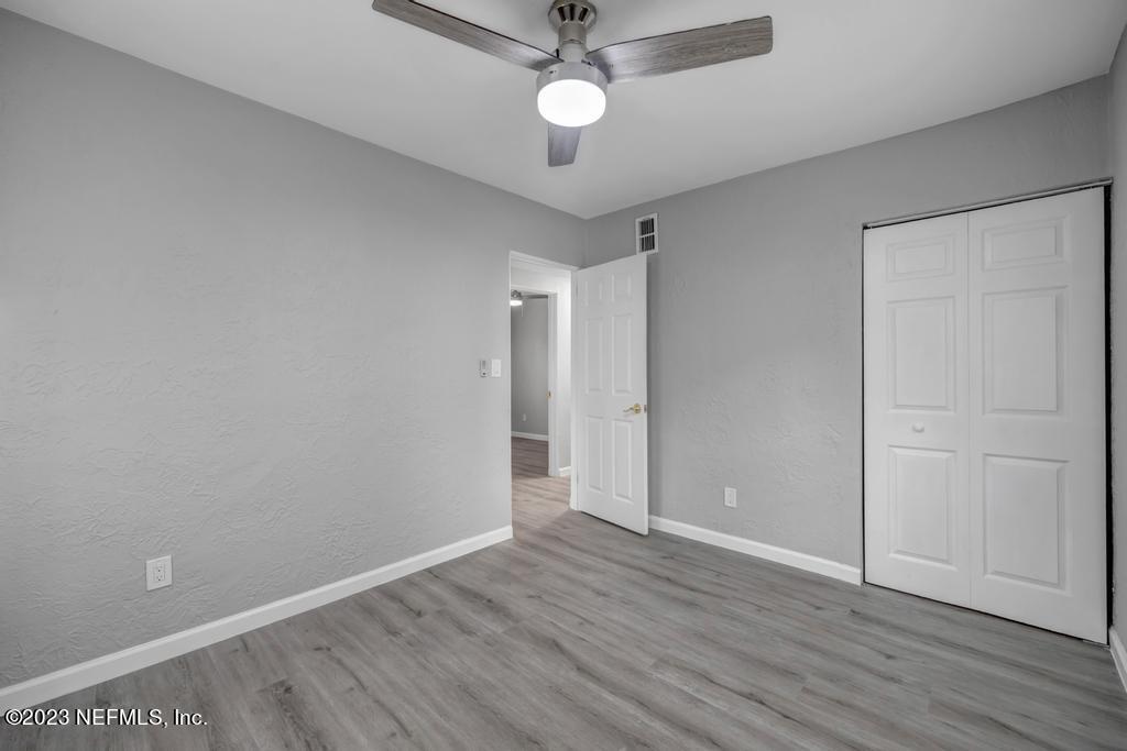 10625 Rutgers Road Jacksonville, FL 32218 - Photo 29 of 37 wooden floor in an empty room