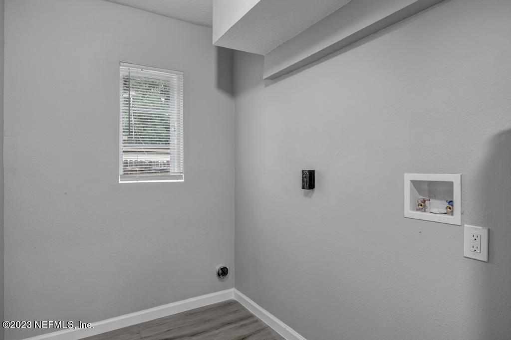 10625 Rutgers Road Jacksonville, FL 32218 - Photo 31 of 37 a view of an empty room with closet and a window