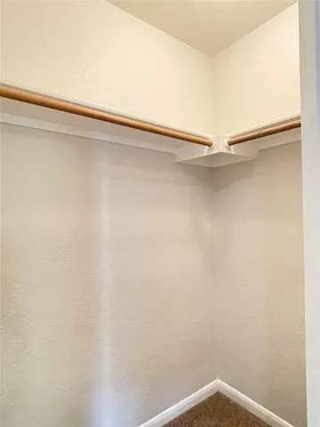a view of a room with shelf on the wall