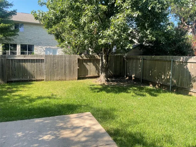 a view of a backyard with a small cabin