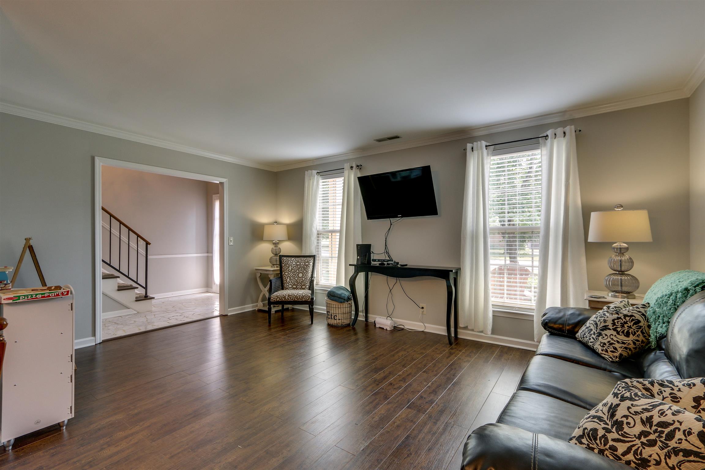 812 General George Patton Road, Unit 812 Nashville, TN 37221 - Photo 6 of 28 a living room with furniture and a flat screen tv