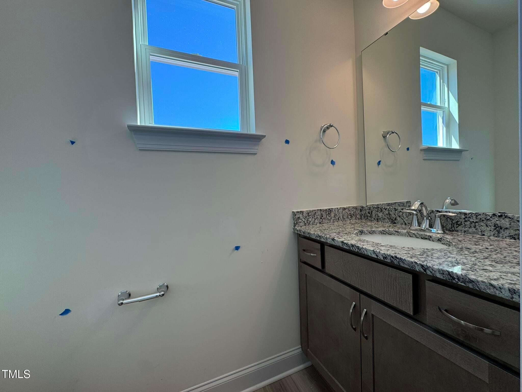 75 Steppe Way Garner, NC 27529 - Photo 14 of 39 a bathroom with a granite countertop sink and a mirror