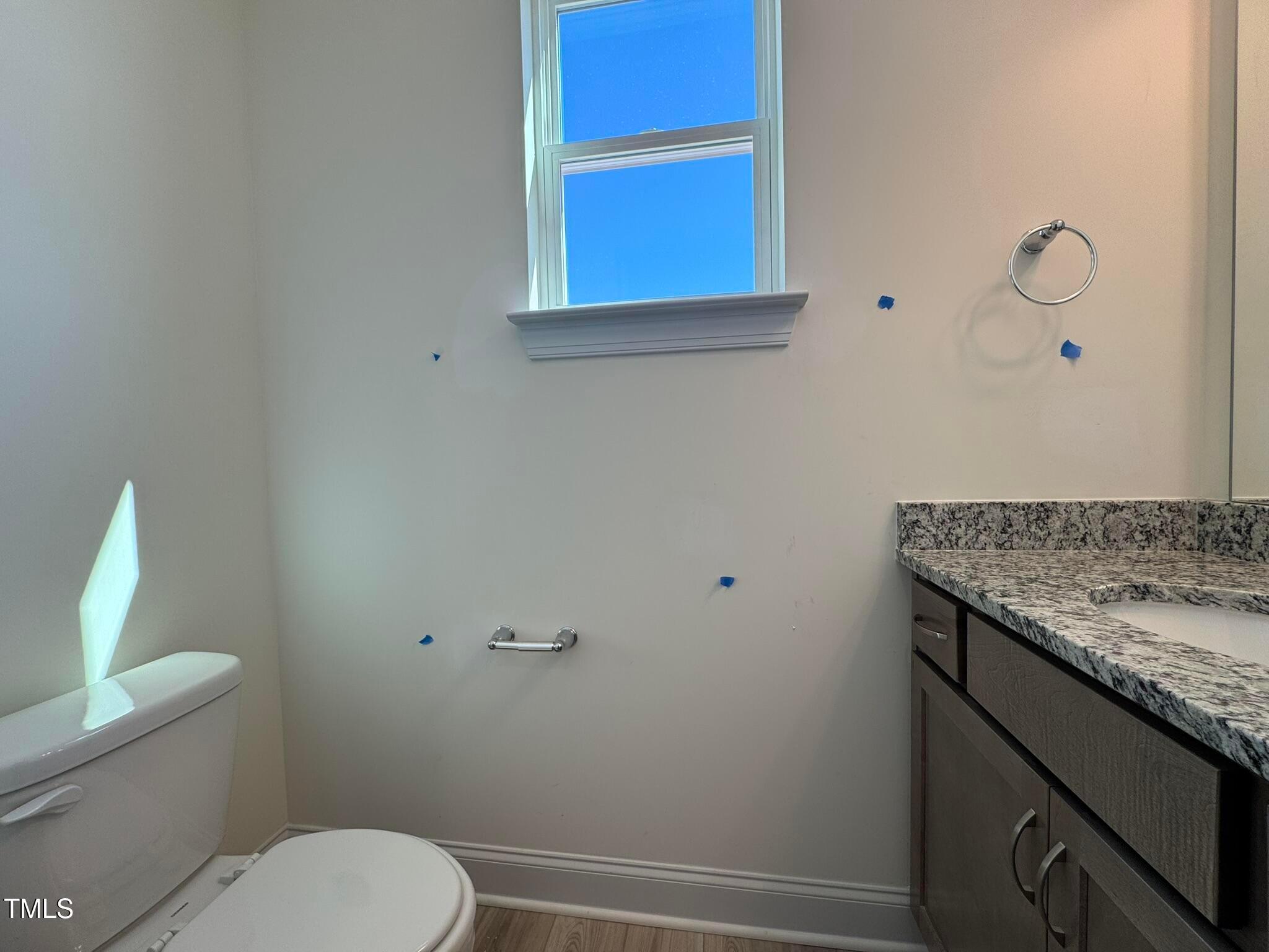 75 Steppe Way Garner, NC 27529 - Photo 15 of 39 a bathroom with a granite countertop toilet and a sink