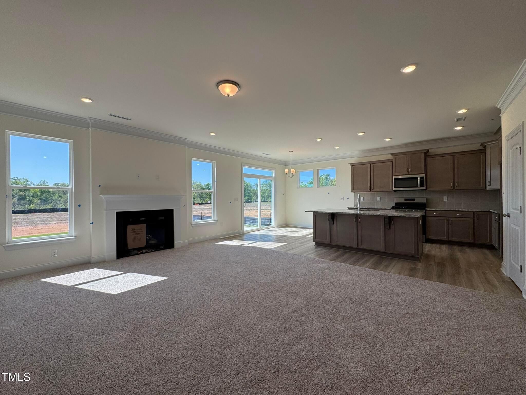 75 Steppe Way Garner, NC 27529 - Photo 18 of 39 a view of an empty room with window and fireplace