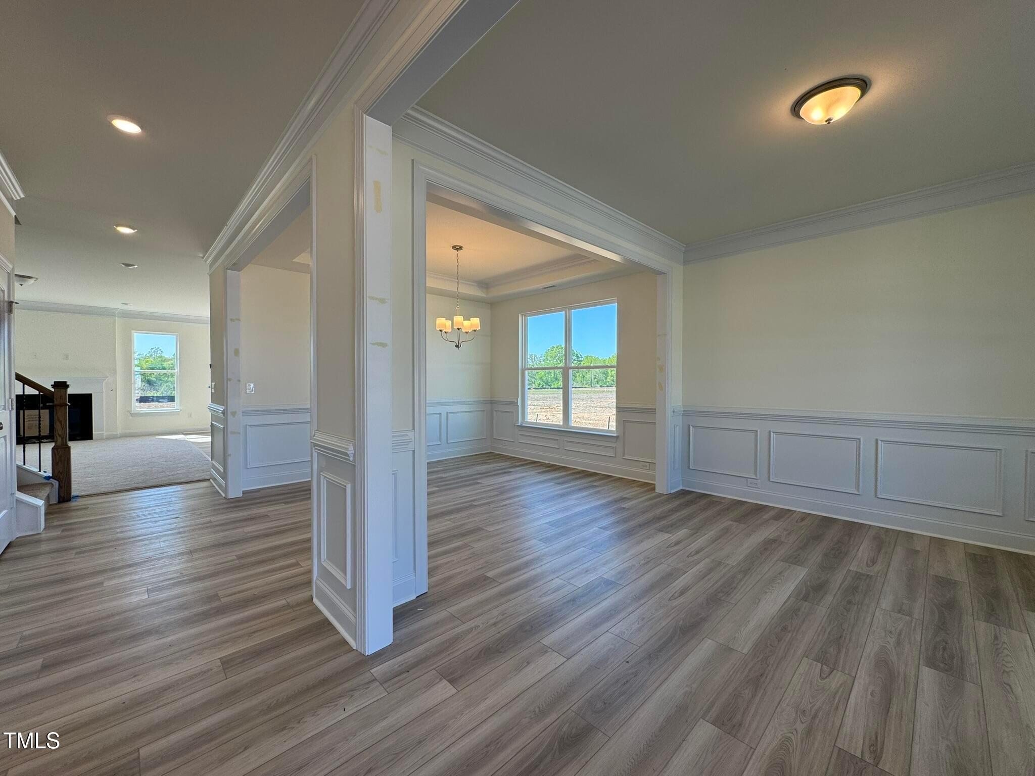 75 Steppe Way Garner, NC 27529 - Photo 2 of 39 a view of a living hall with wooden floor and a large window