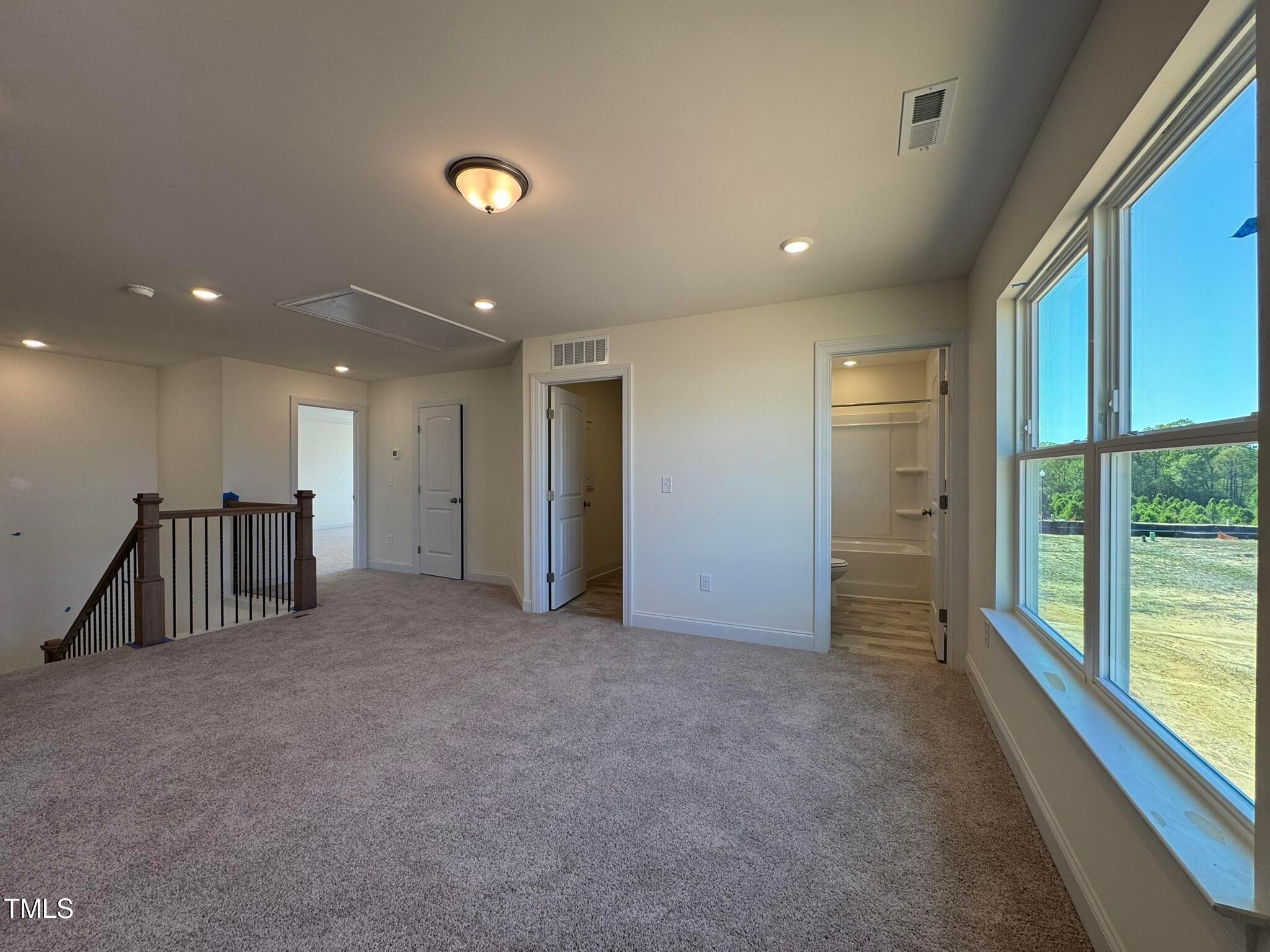 75 Steppe Way Garner, NC 27529 - Photo 21 of 39 a view of an empty room with a balcony