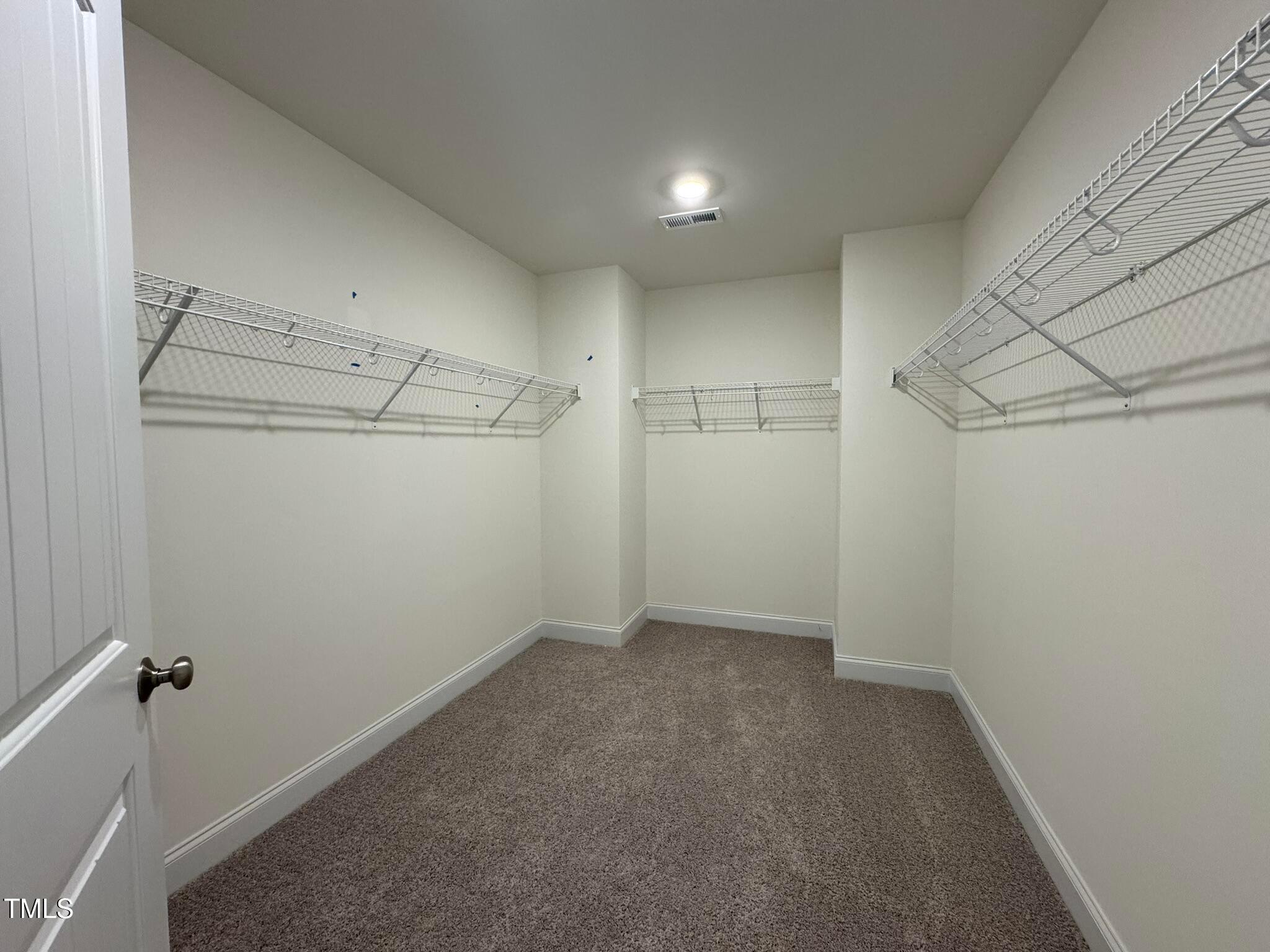 75 Steppe Way Garner, NC 27529 - Photo 29 of 39 a view of a room with racks on the wall