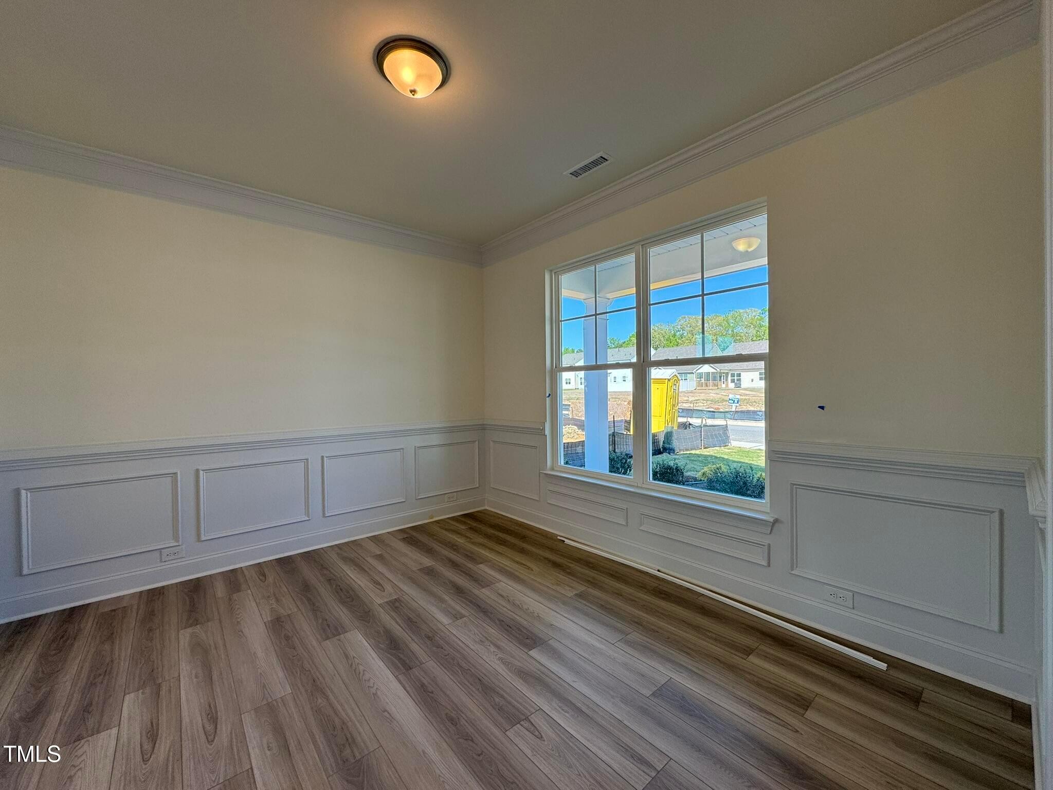75 Steppe Way Garner, NC 27529 - Photo 3 of 39 a view of empty room with wooden floor and fan