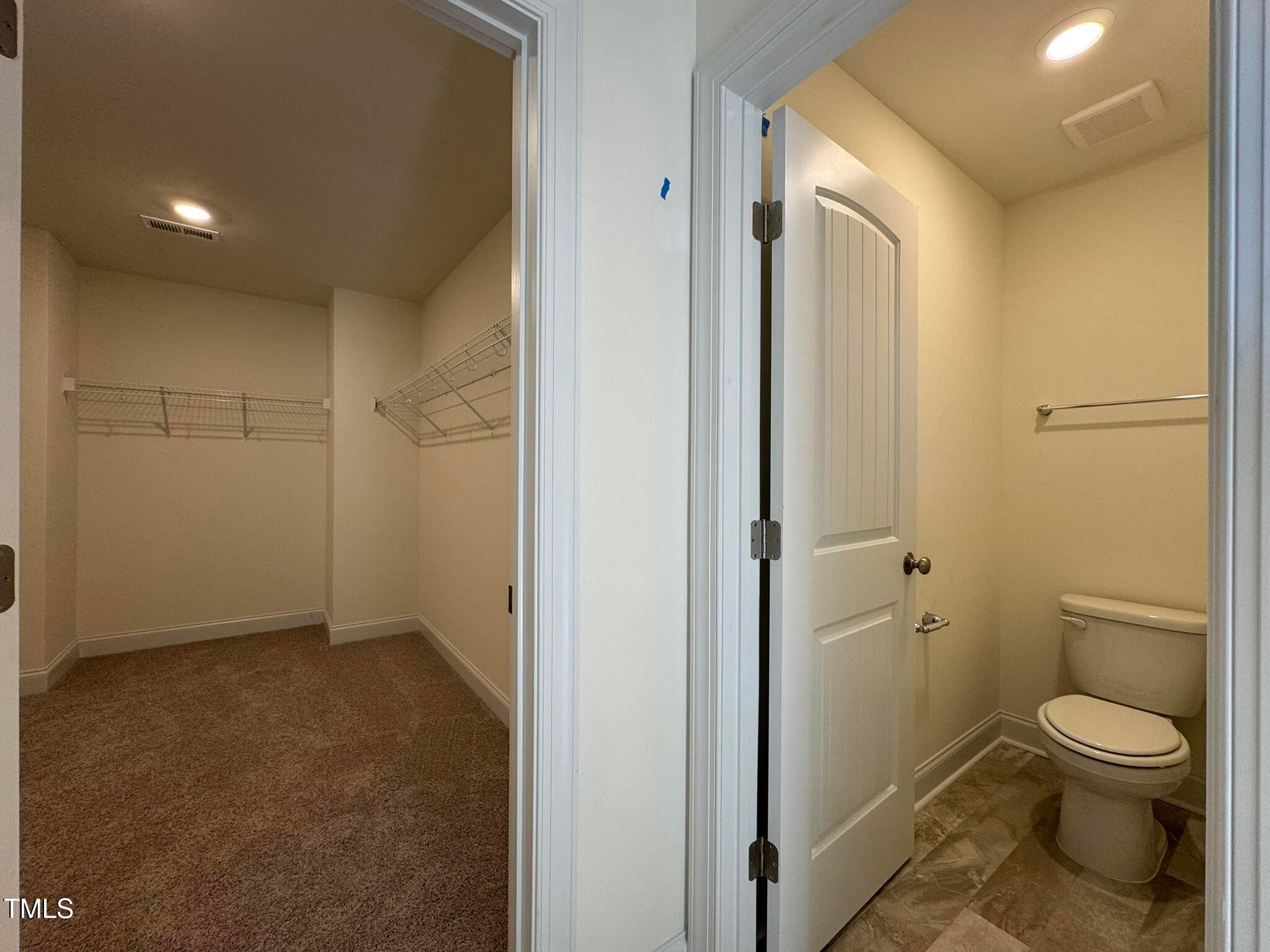 75 Steppe Way Garner, NC 27529 - Photo 31 of 39 a bathroom with a granite countertop toilet a sink and a mirror