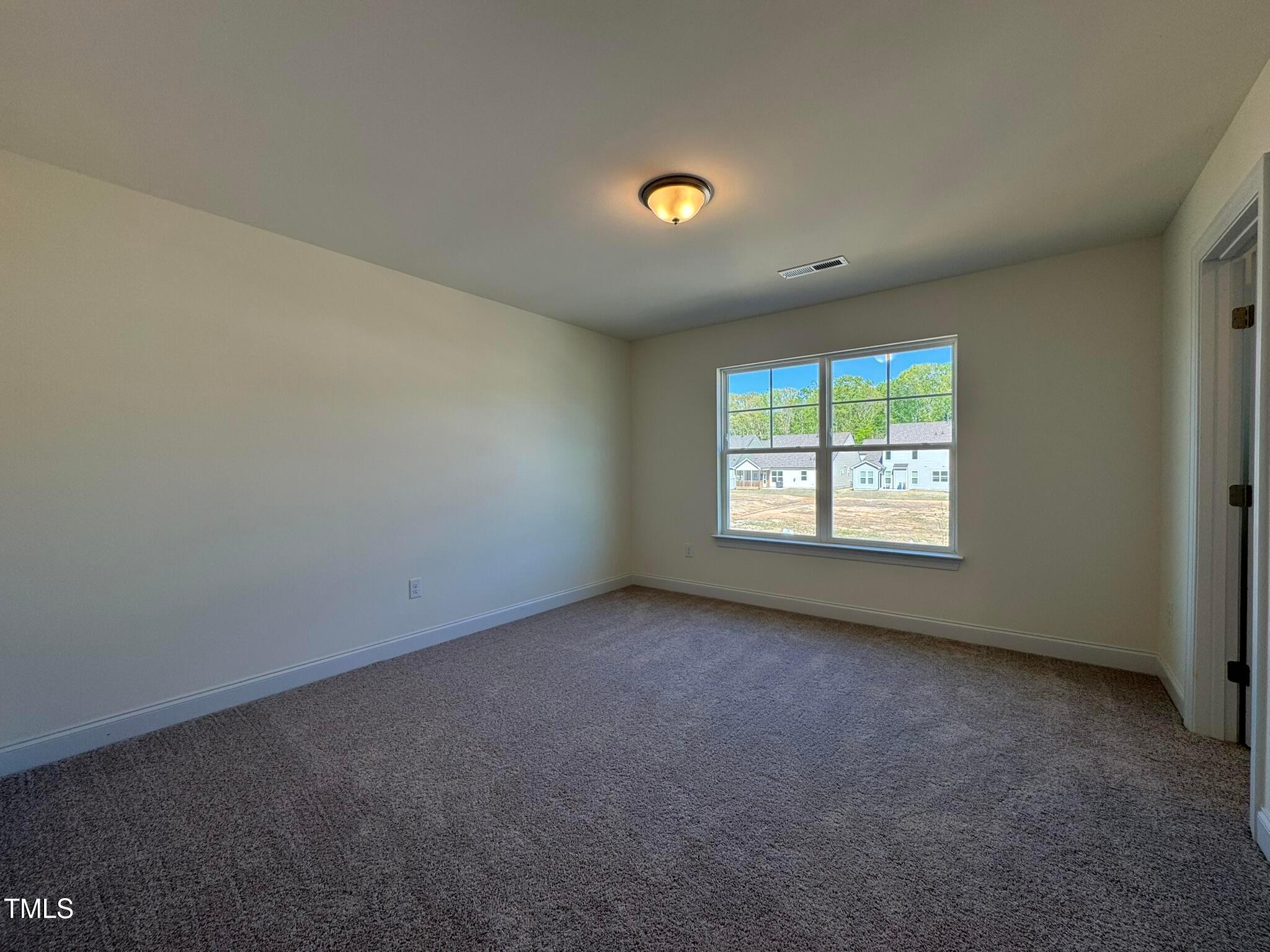 75 Steppe Way Garner, NC 27529 - Photo 32 of 39 an empty room with a window
