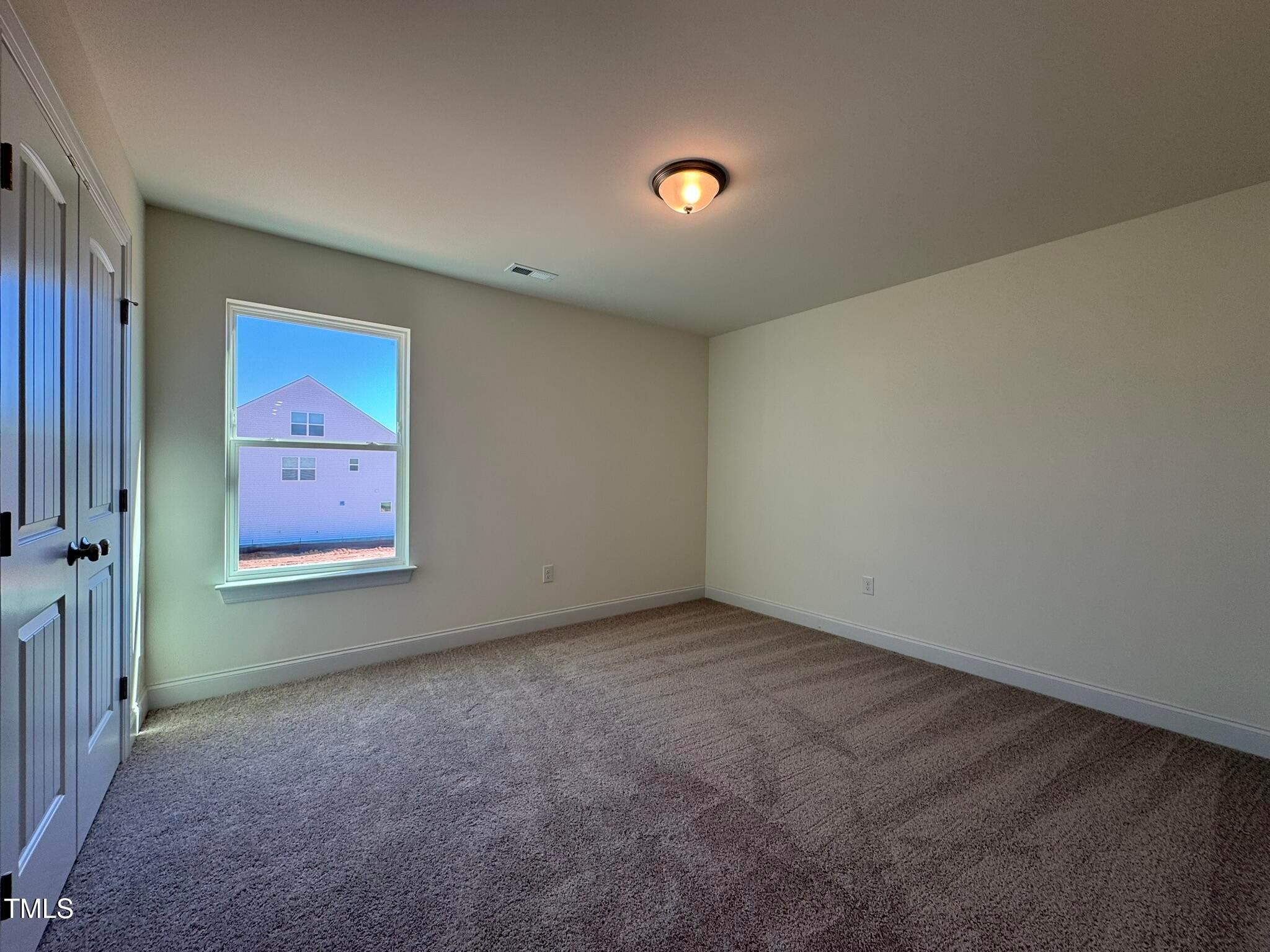 75 Steppe Way Garner, NC 27529 - Photo 36 of 39 an empty room with windows