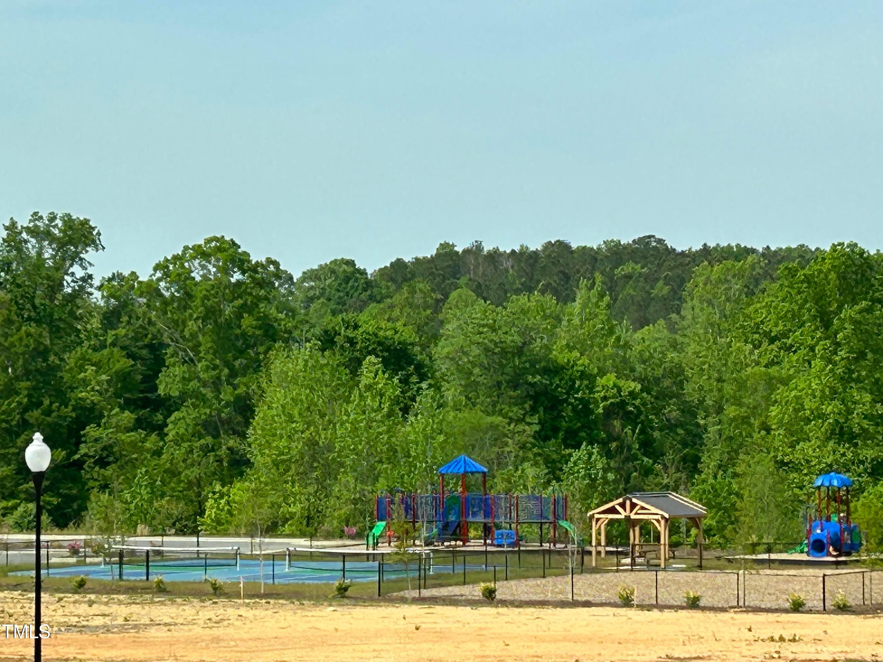 75 Steppe Way Garner, NC 27529 - Photo 39 of 39 a view of swimming pool with seating area and trees around