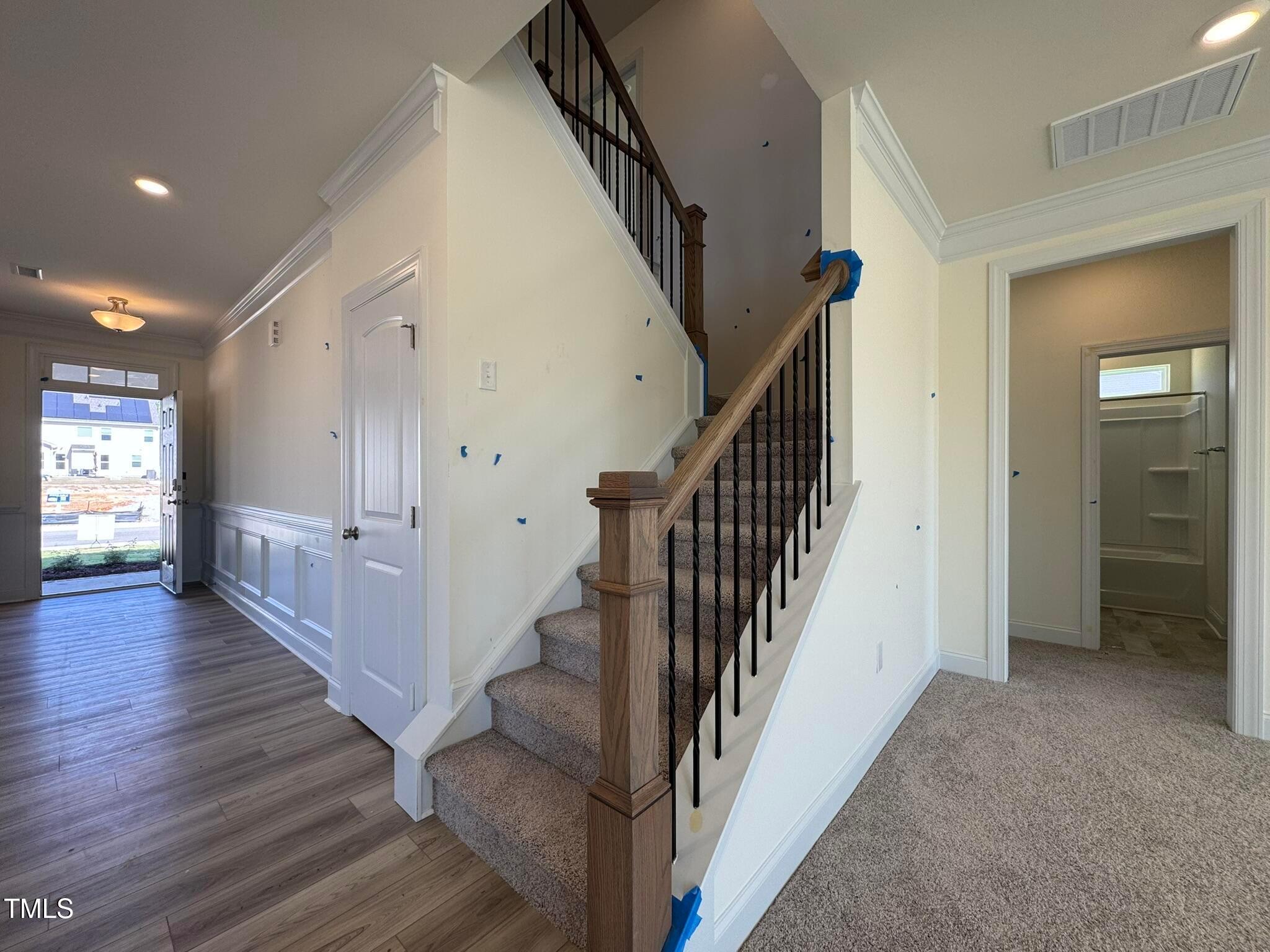 75 Steppe Way Garner, NC 27529 - Photo 10 of 39 a view of a hallway with wooden floor and stairs