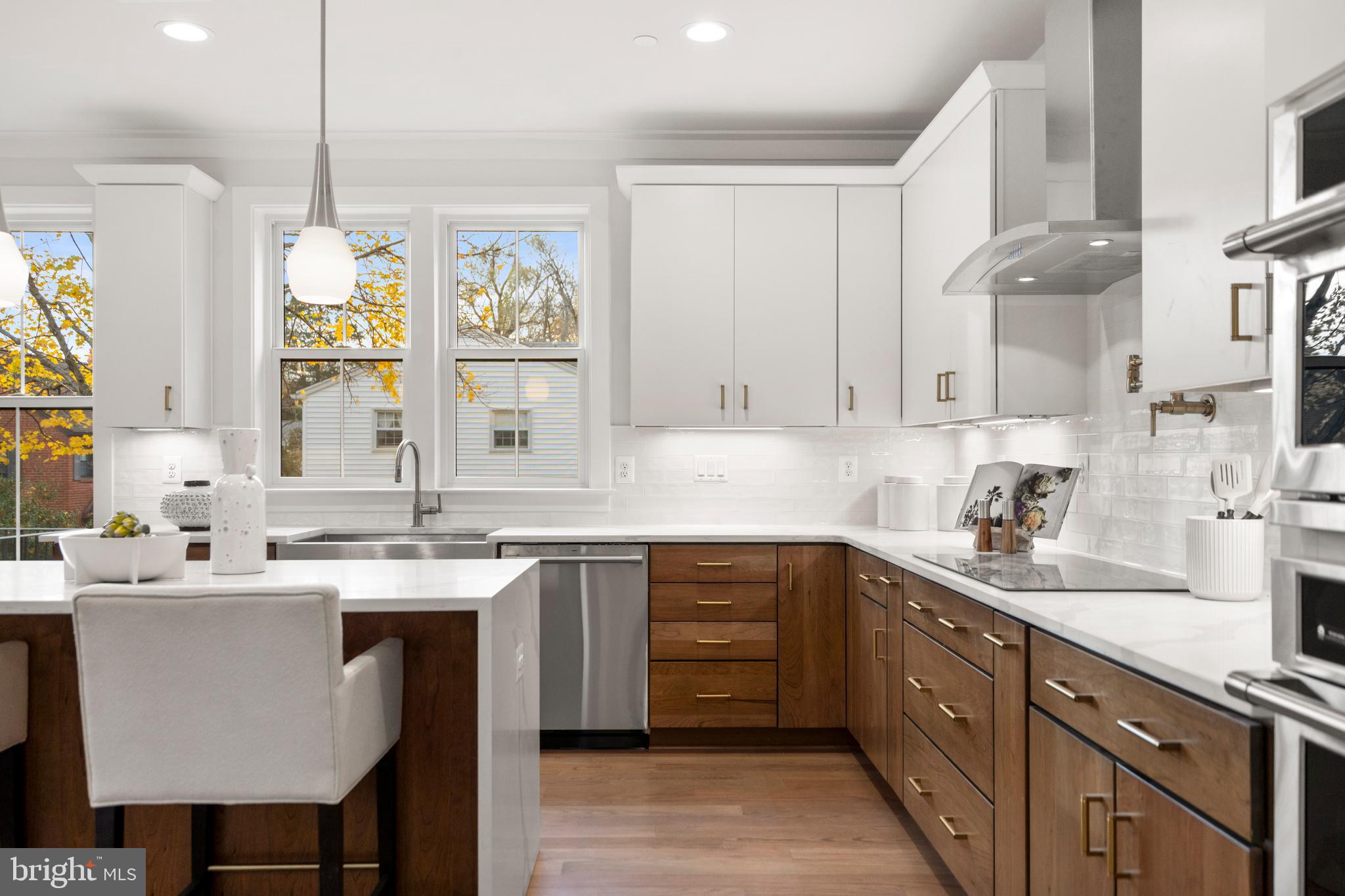 8506 Hempstead Avenue Bethesda, MD 20817 - Photo 19 of 57 a kitchen with a sink cabinets and window
