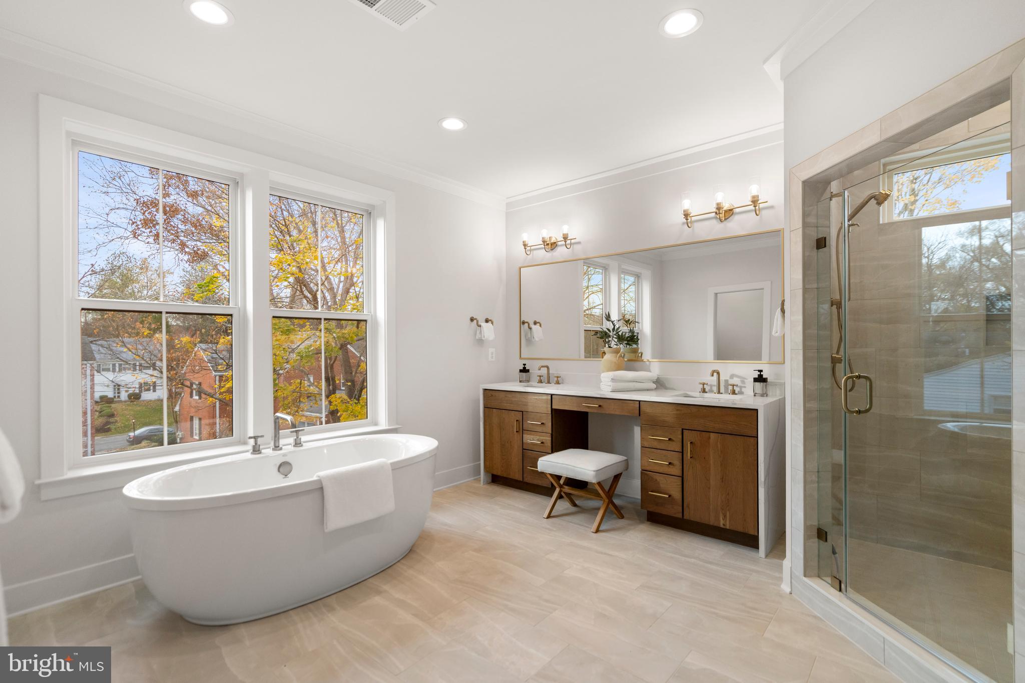8506 Hempstead Avenue Bethesda, MD 20817 - Photo 29 of 57 a bathroom with a tub a sink a mirror and a shower