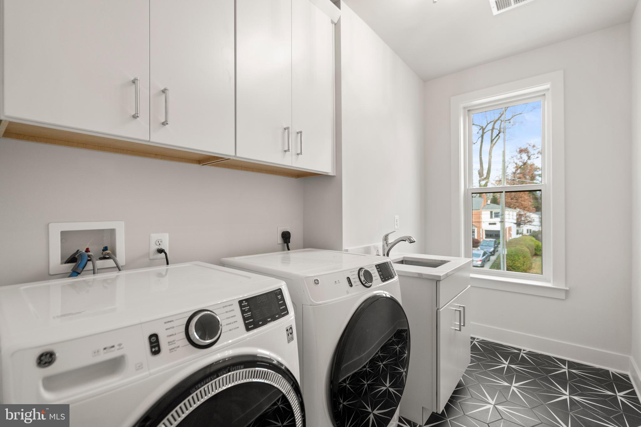 8506 Hempstead Avenue Bethesda, MD 20817 - Photo 37 of 57 a utility room with dryer and washer
