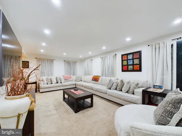 a living room with furniture and a couch