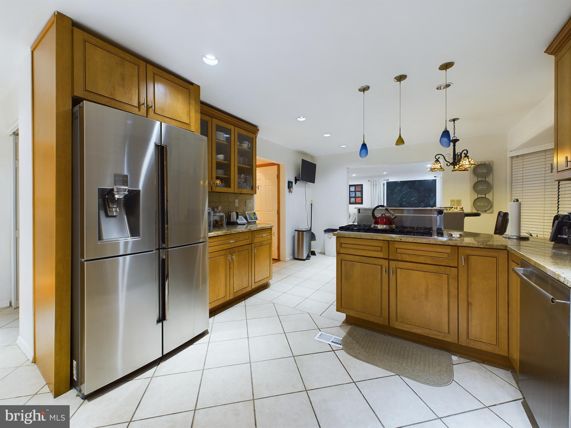 2906 Cedar Lane Vienna, VA 22180 - Photo 10 of 18 a kitchen with cabinets and stainless steel appliances