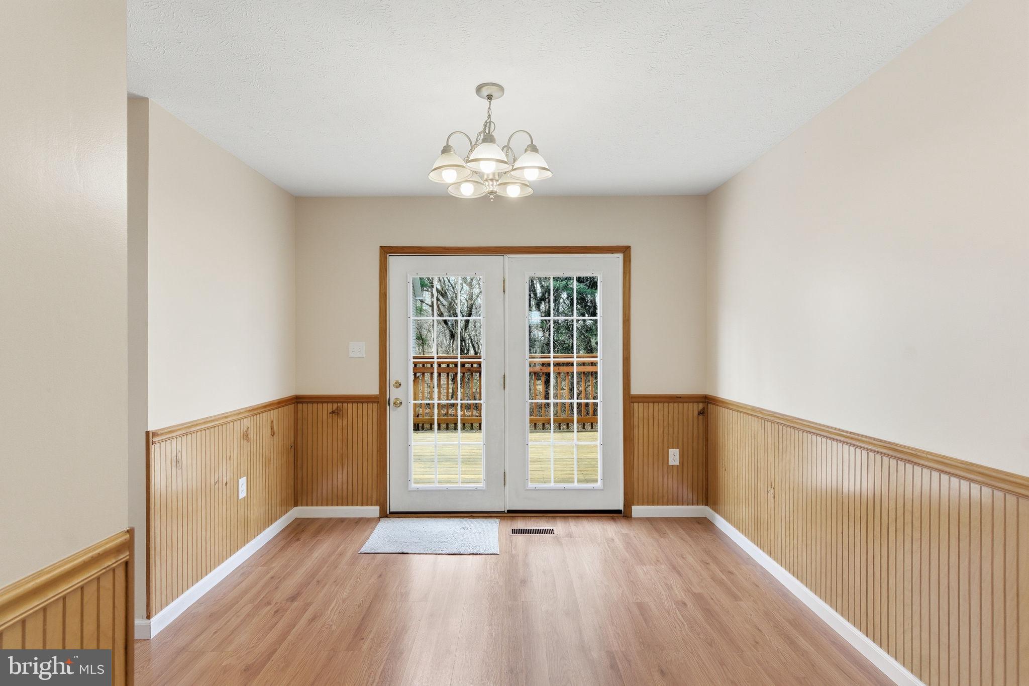 148 Vinca Lane Falling Waters, WV 25419 - Photo 11 of 71 wooden floor in an empty room with a window