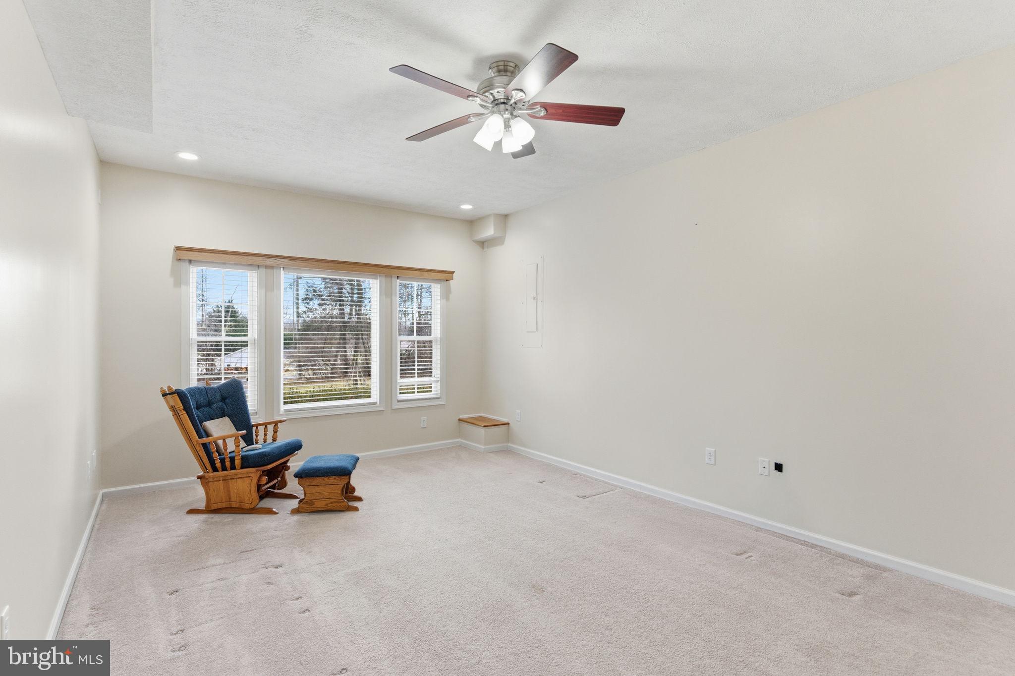 148 Vinca Lane Falling Waters, WV 25419 - Photo 18 of 71 a living room with furniture and a large window with outer view