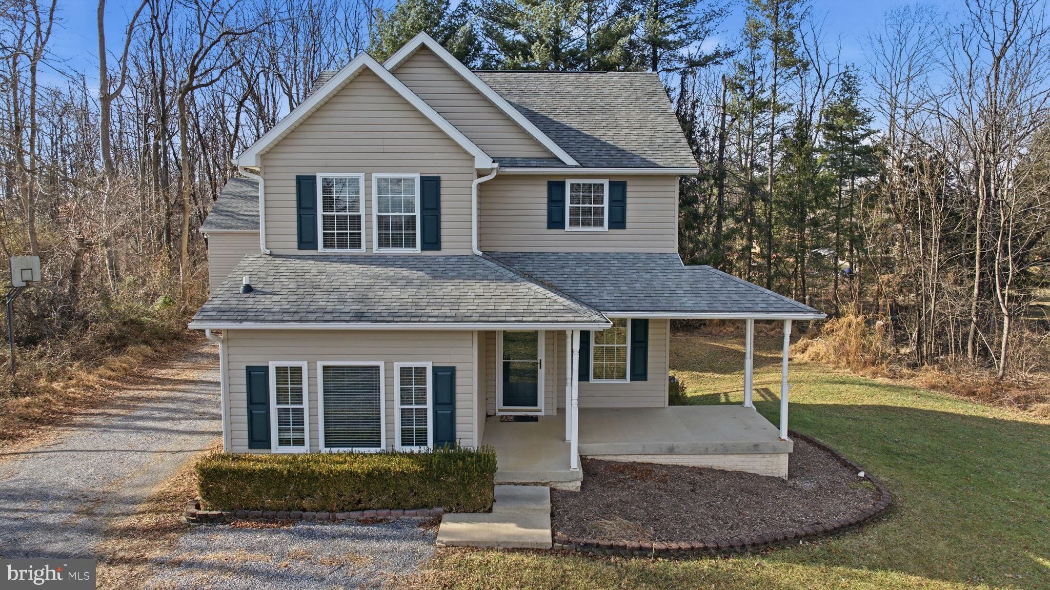 148 Vinca Lane Falling Waters, WV 25419 - Photo 2 of 71 a front view of a house with a yard