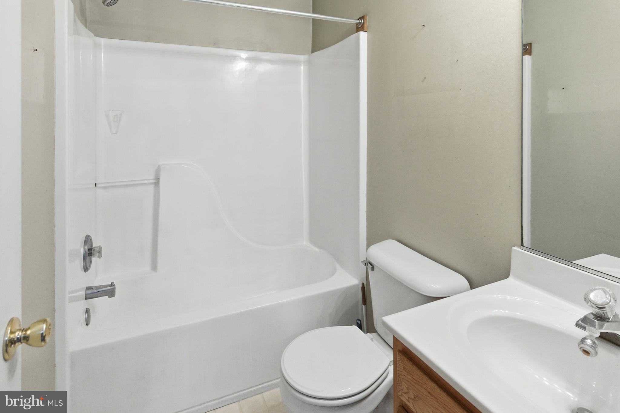 148 Vinca Lane Falling Waters, WV 25419 - Photo 31 of 71 a white toilet sitting next to a bath tub