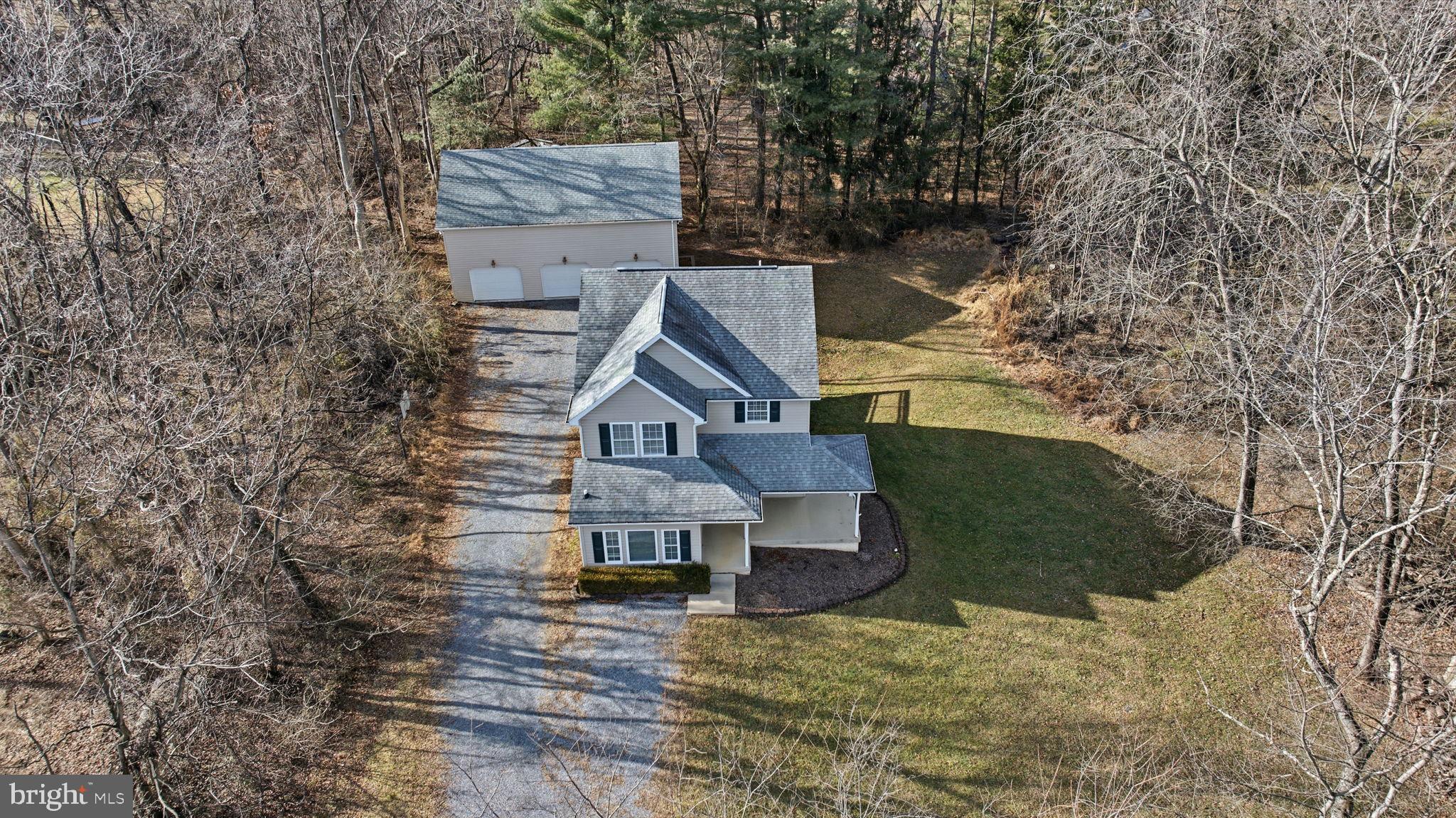 148 Vinca Lane Falling Waters, WV 25419 - Photo 4 of 71 front view of a house with a yard