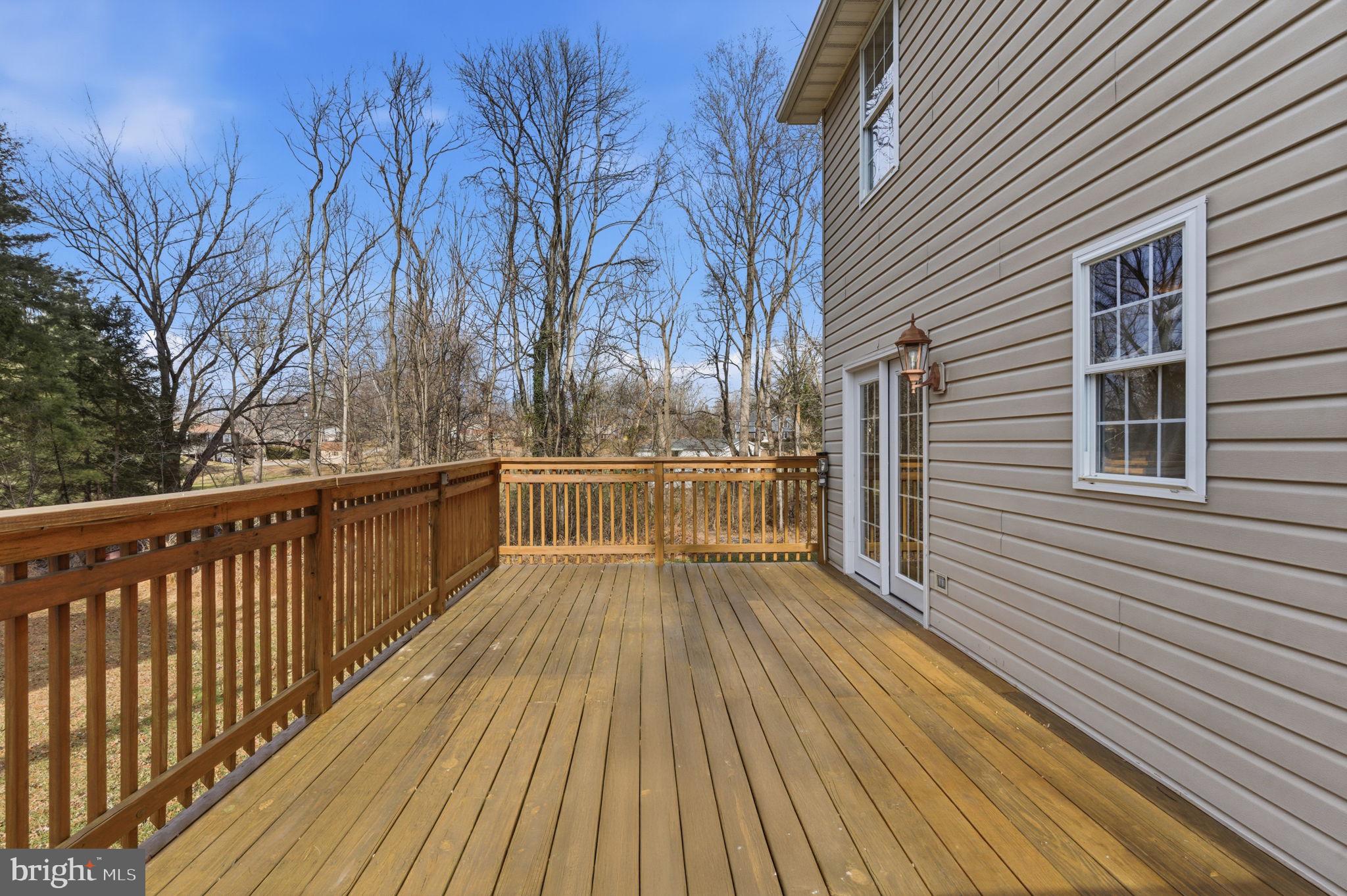 148 Vinca Lane Falling Waters, WV 25419 - Photo 41 of 71 a view of a balcony with wooden floor and fence and a wooden floor